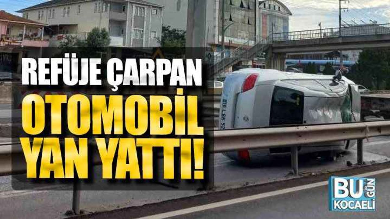 Refüje çarpan otomobil yan yattı!